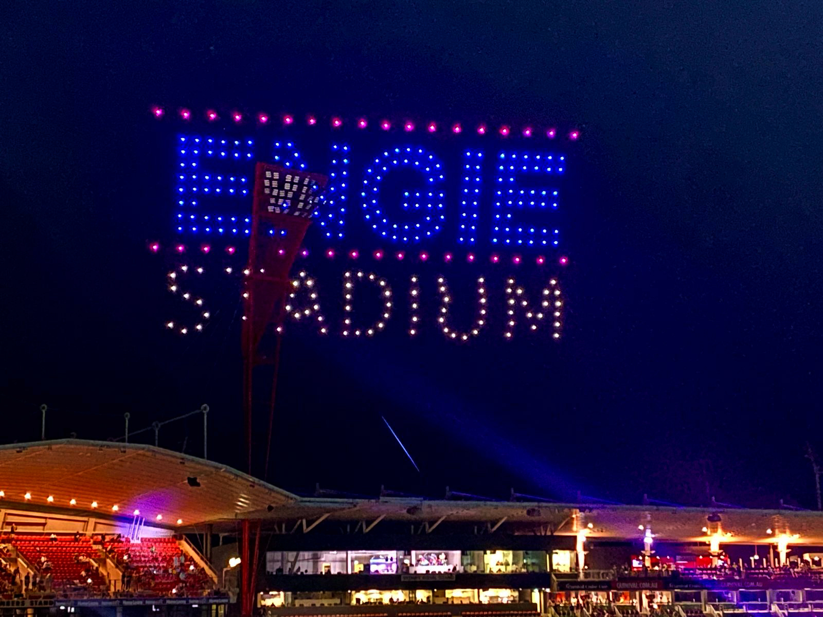 Drone light display spelling 'ENGIE Stadium' above the illuminated arena during a Sydney Thunder Big Bash League event, captivating the audience